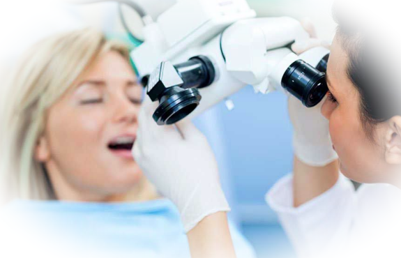 Когда применяется лечение зубов под микроскопом?